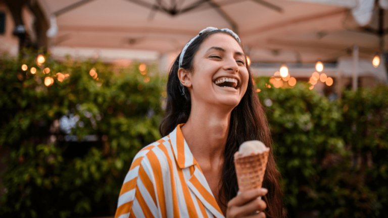 woman holding a cone of gelato